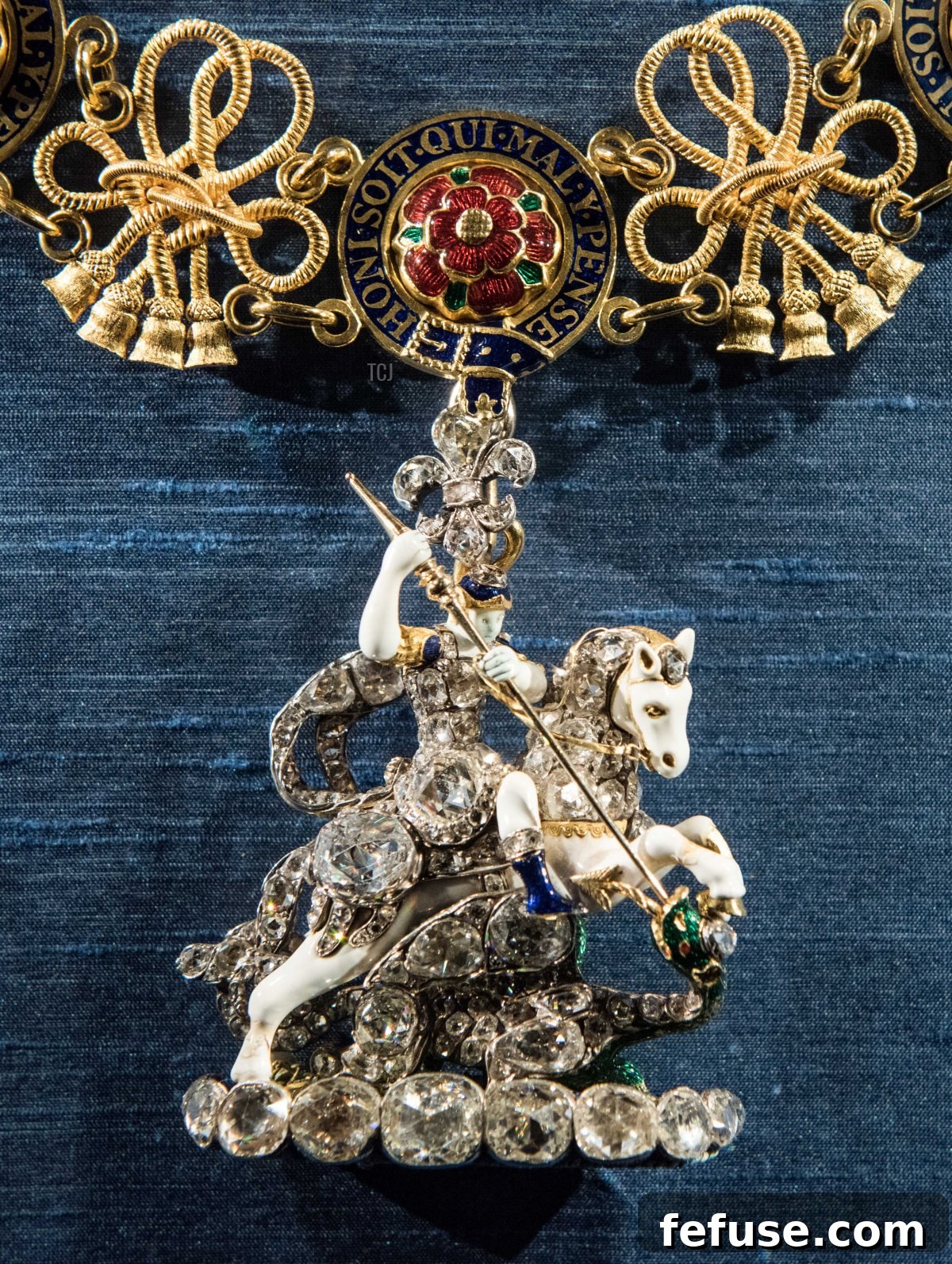 Close-up of Queen Elizabeth II's Garter Collar and Badge, featuring the 'Marlborough George' emblem, exhibited at Windsor Castle. (Nicky J Sims/Getty Images)