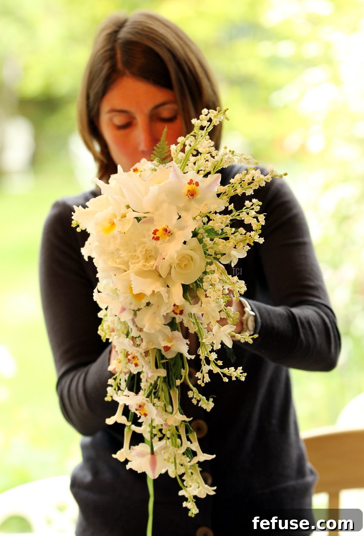 Lottie Longman arranging a replica of Queen Elizabeth II's Coronation bouquet for a 60th-anniversary celebration, in Ilford, England. (Sean Dempsey - WPA Pool/Getty Images)