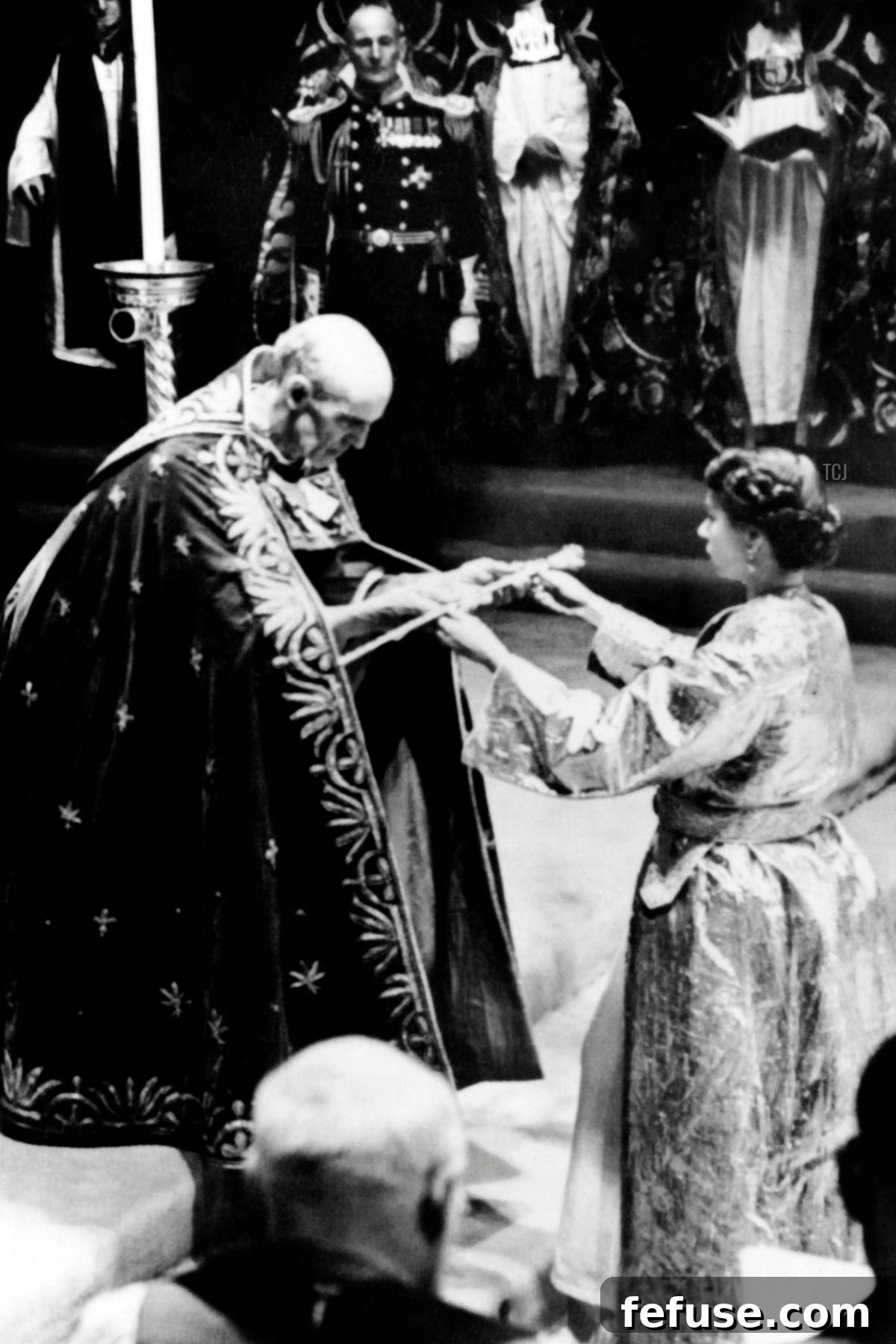 Archbishop Geoffrey Fisher presenting various pieces of coronation regalia to Queen Elizabeth II during her Coronation ceremony at Westminster Abbey. (INTERCONTINENTALE/AFP via Getty Images)