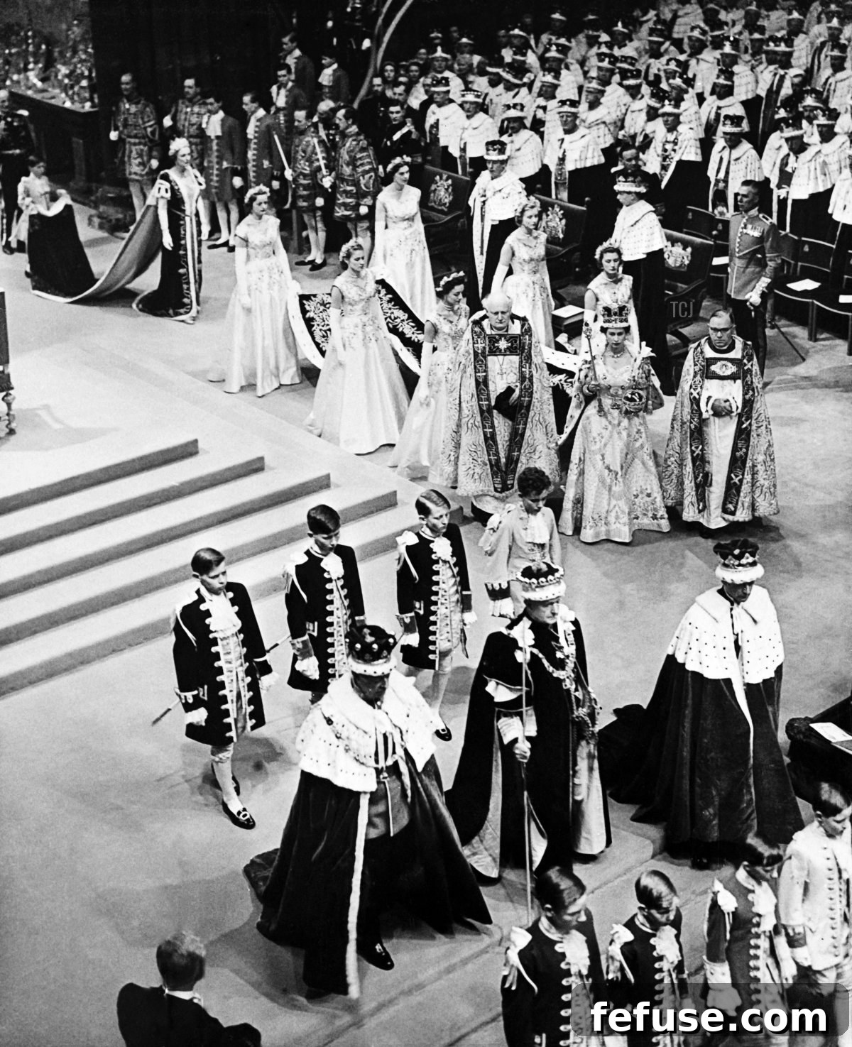Queen Elizabeth II departing Westminster Abbey after her Coronation ceremony on June 2, 1953, showcasing her Imperial State Crown and Orb. (INTERCONTINENTALE/AFP via Getty Images)