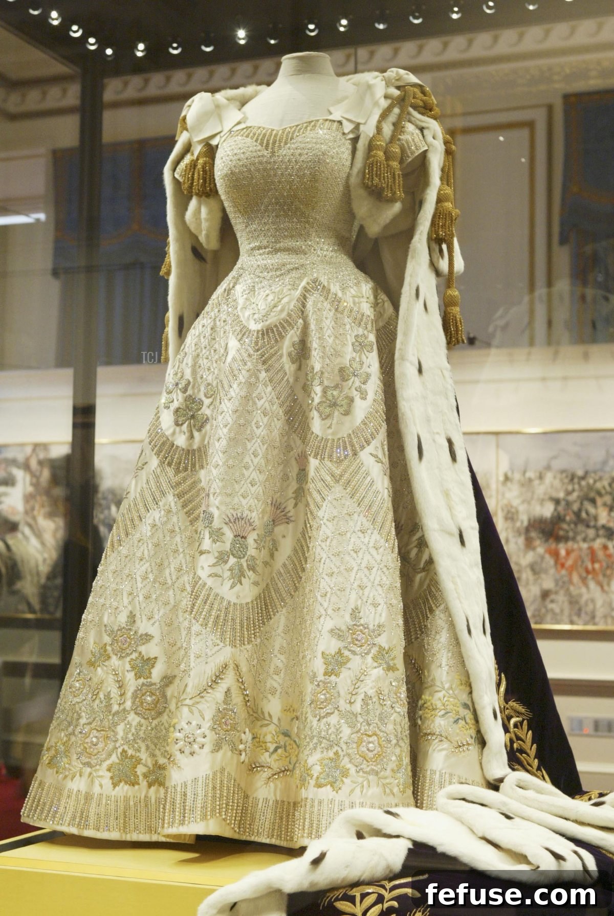 Queen Elizabeth II's Coronation dress and ceremonial robes displayed at Buckingham Palace, showcasing the full splendor of her regalia. (Steve Finn/Getty Images)