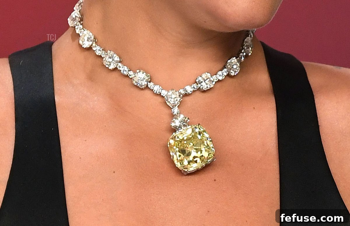 Lady Gaga showcasing the iconic Tiffany Lucida Star Necklace adorned with the legendary Tiffany Yellow Diamond at the 2019 Academy Awards.