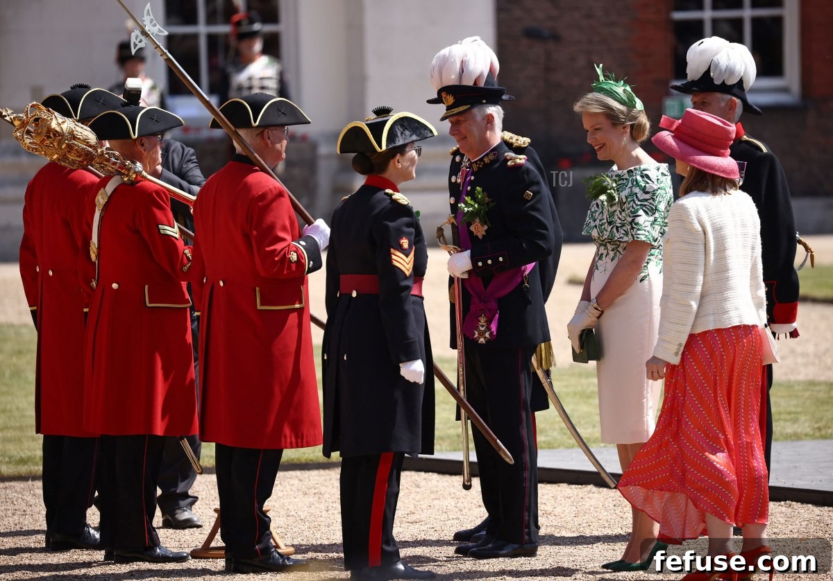 The King and Queen of the Belgians observe the Founder's Day Parade at the Royal Hospital Chelsea, London. (HENRY NICHOLLS/AFP via Getty Images)