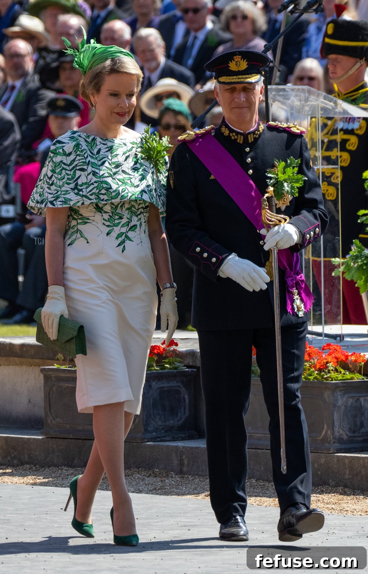 Queen Mathilde of the Belgians in a striking green leaf print dress at the Founder's Day Parade. (Carl Court/Getty Images)