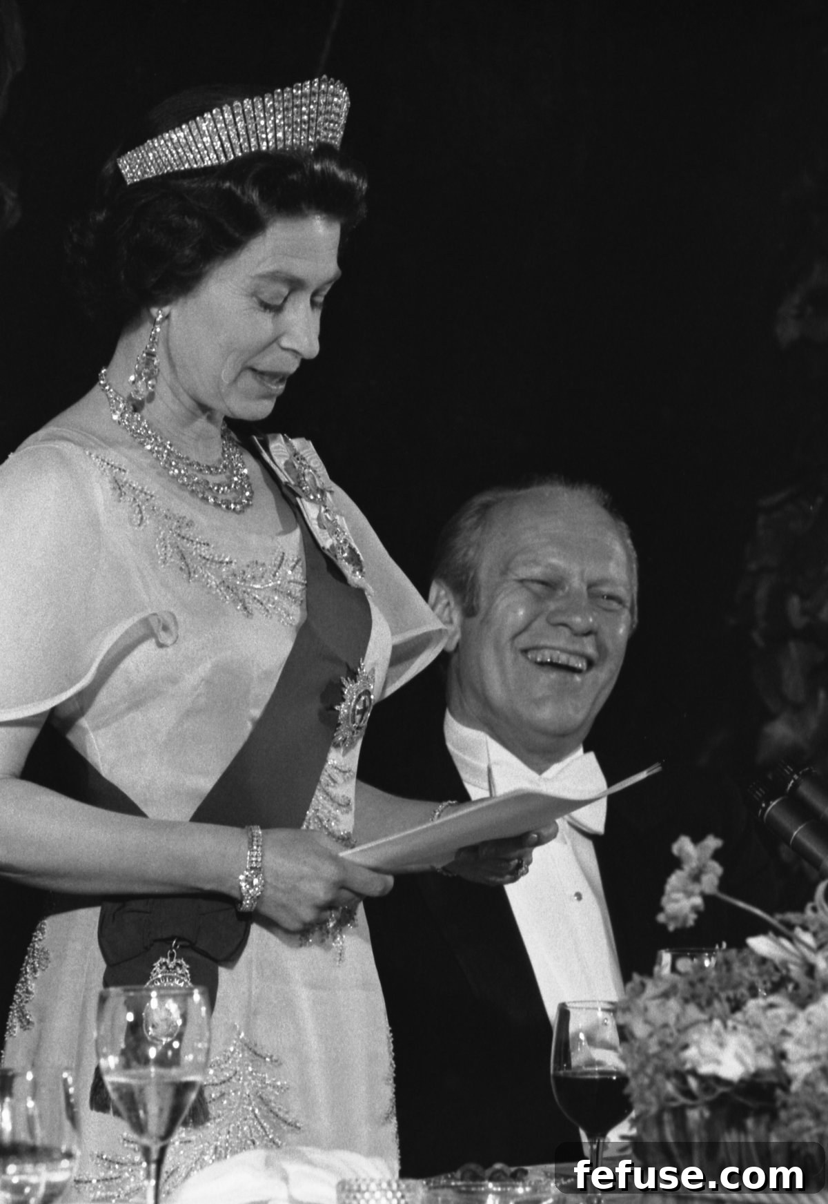President Ford laughs at Queen Elizabeth II's remarks during a state dinner at the White House in Washington, D.C., July 7, 1976