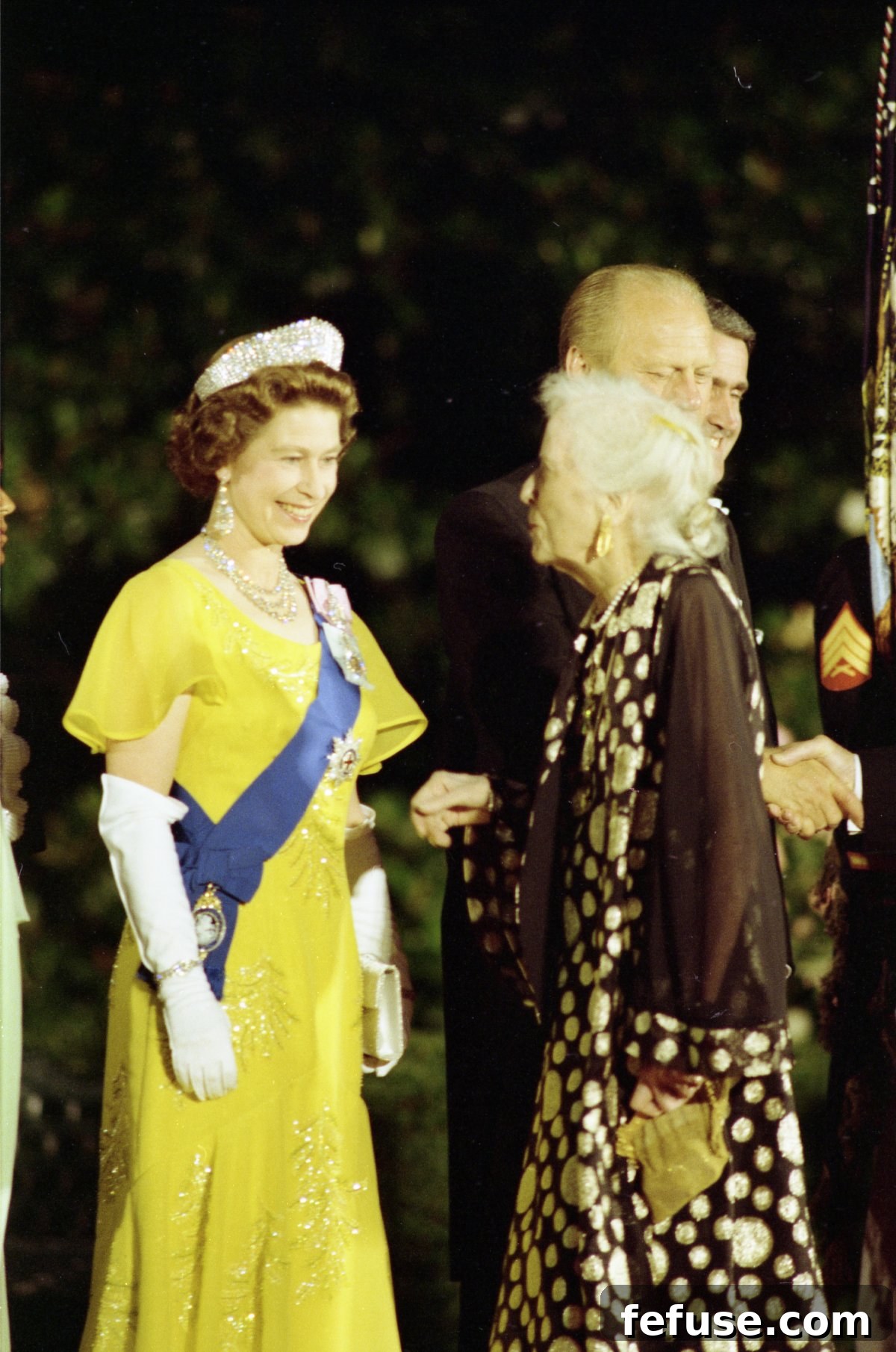 Queen Elizabeth II meets Alice Roosevelt Longworth, daughter of President Theodore Roosevelt, before a state dinner at the White House in Washington, D.C., July 7, 1976