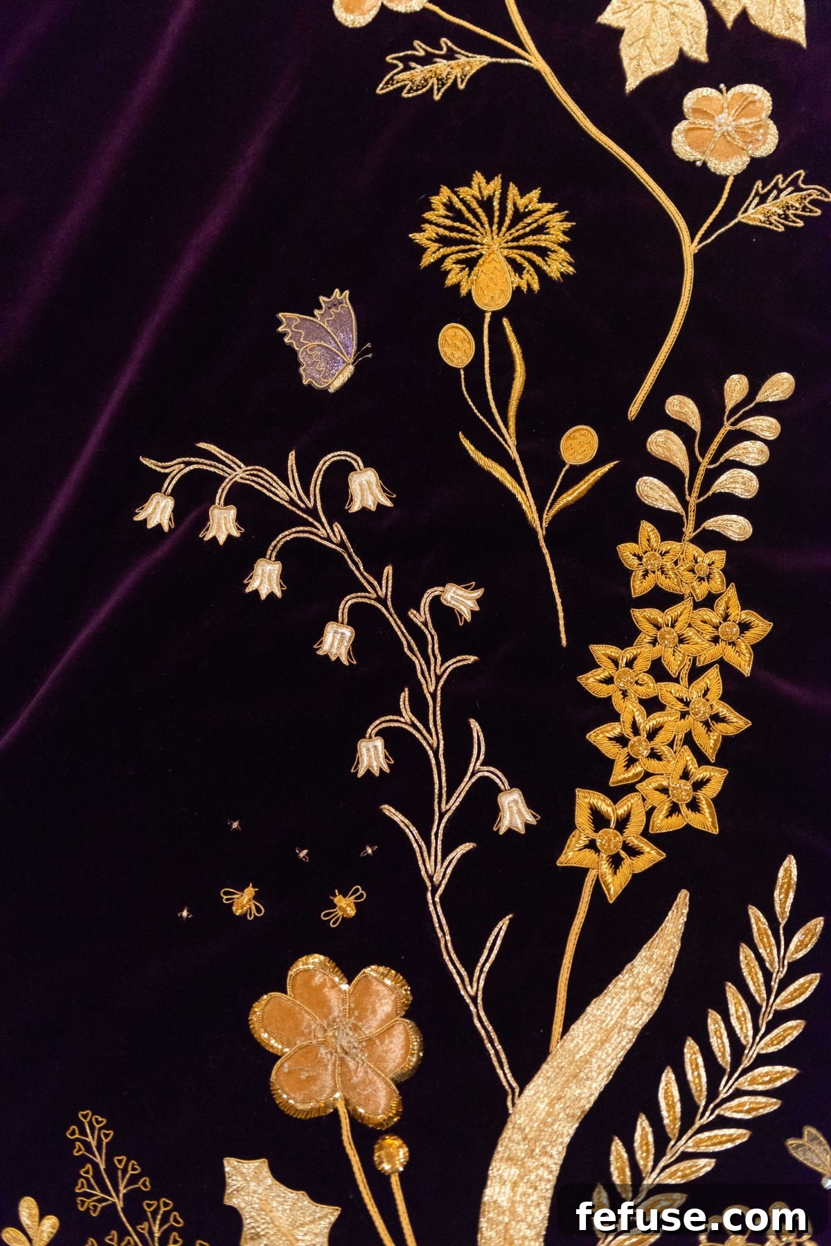 The groundbreaking inclusion of embroidered insects, including bees and butterflies, on Queen Camilla's Coronation robe, on display at Buckingham Palace in July 2023. (Royal Collection Trust)