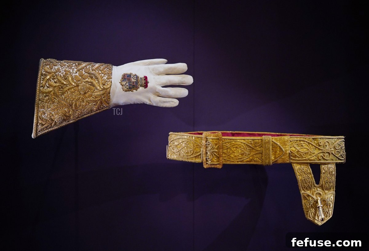 The Coronation Glove and Girdle (Coronation Sword Belt) worn by King Charles III, both reused from King George VI's Coronation, presented at Buckingham Palace, July 2023. (Yui Mok/PA Images/Alamy)