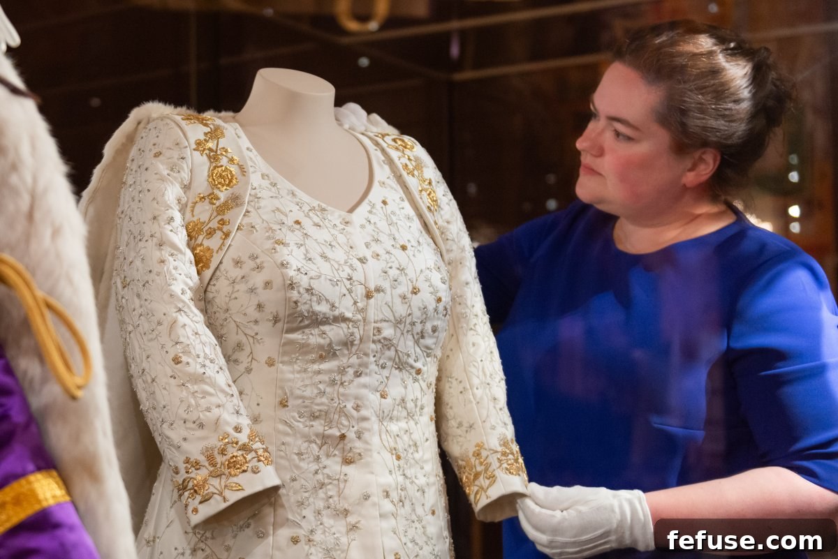 Queen Camilla's Coronation Dress, designed by Bruce Oldfield with intricate embroidery, on display for public viewing at Buckingham Palace in July 2023. (Royal Collection Trust)