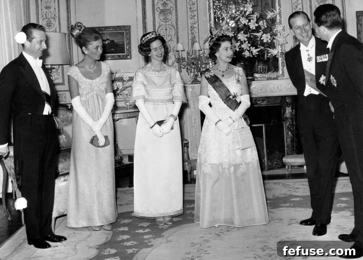The Enduring Radiance of King George VI's Royal Sapphires 11 Prince Albert and Princess Paola of Belgium, Queen Fabiola of the Belgians, Queen Elizabeth II, Prince Philip, and King Baudouin of the Belgians attend a dinner at the British Embassy in Brussels, May 1966 (Belga News Agency/Alamy)