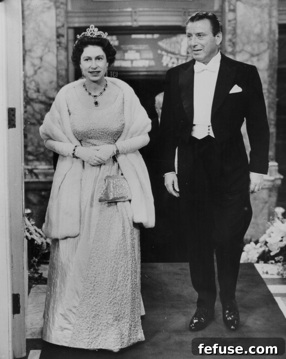 The Enduring Radiance of King George VI's Royal Sapphires 10 Queen Elizabeth II, with Lord Bernard Delfont, attends the Royal Variety Performance at the London Palladium on November 8, 1965 (Central Press/Hulton Archive/Getty Images)