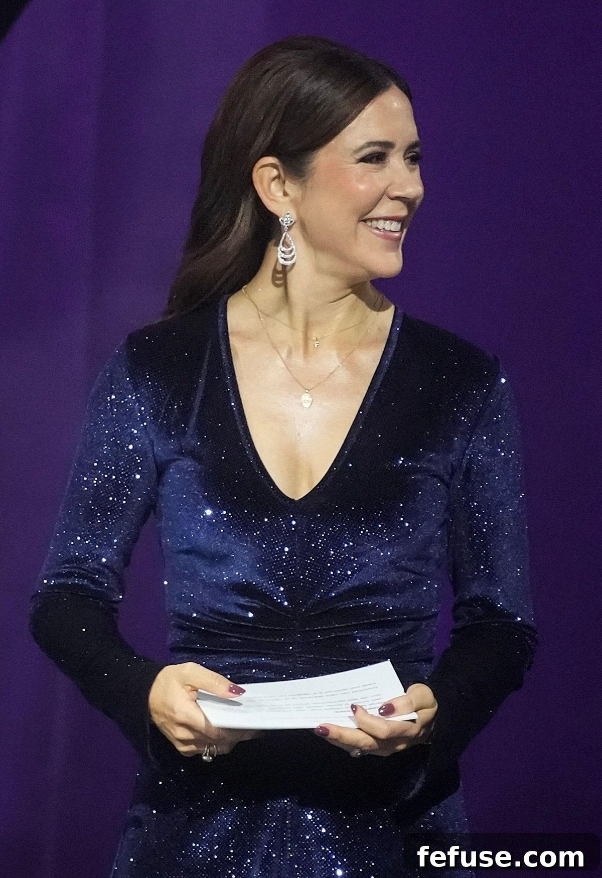 Crown Princess Mary of Denmark extends her hand to present an award, revealing her stunning diamond rings, in the Concert Hall of Musikhuset in Esbjerg on November 4, 2023. (Ritzau Scanpix/Alamy)