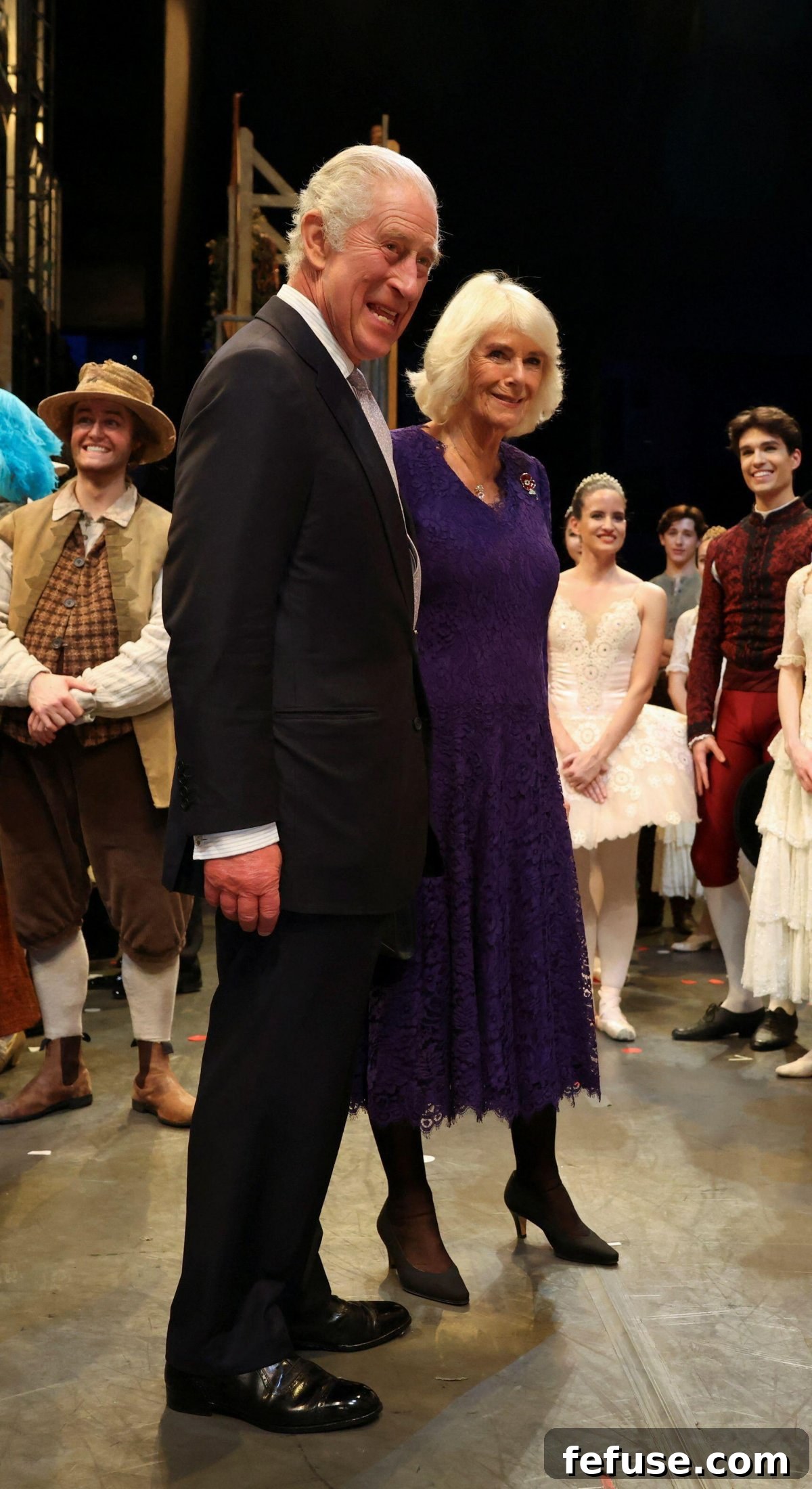 Regal Pink Topaz and Sapphire Pendant for Queen Camilla 5 Queen Camilla elegantly dressed in a lace gown by Fiona Clare for the Royal Ballet performance, demonstrating her refined fashion sense.