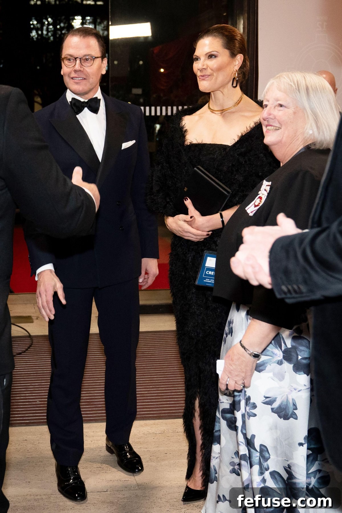 Crown Princess Victoria of Sweden in a black dress with a textured wrap at the Royal Variety Performance in London.