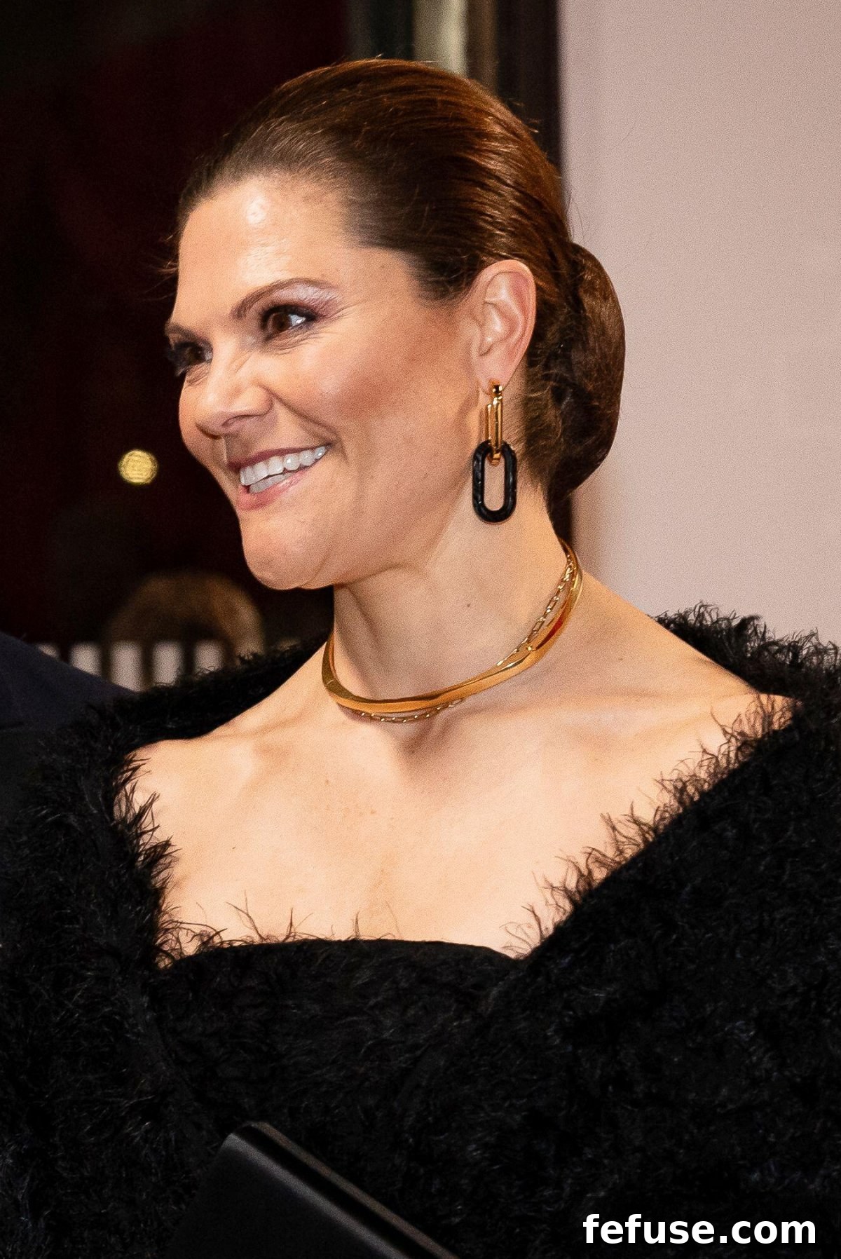 Crown Princess Victoria of Sweden wearing bold, modern gold and black chain-link earrings at the Royal Variety Performance.