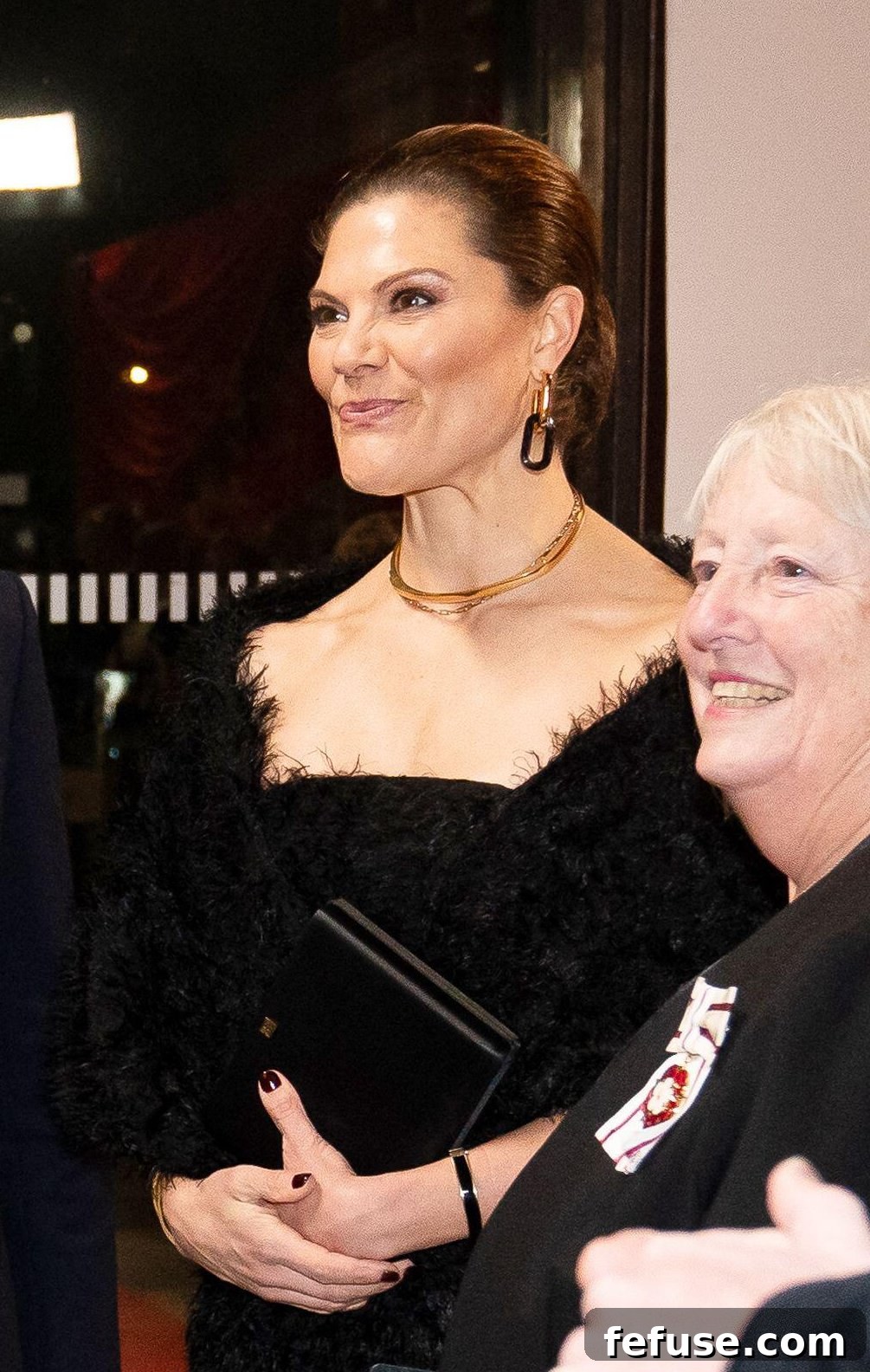 Crown Princess Victoria's layered gold necklaces and black enamel bracelet, all from Swedish brand Toteme, at the Royal Variety Performance.