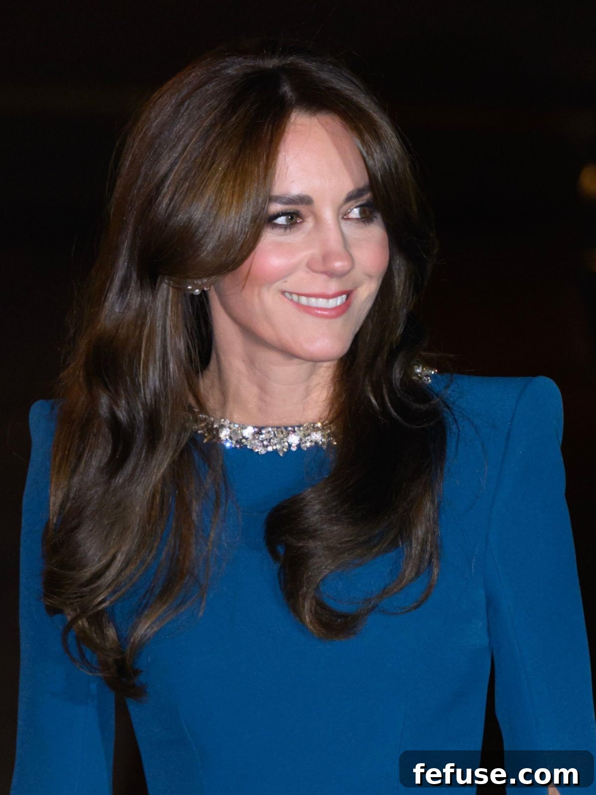 Close-up of the Princess of Wales at the Royal Variety Performance, highlighting her pearl earrings complementing her blue Safiyaa gown.