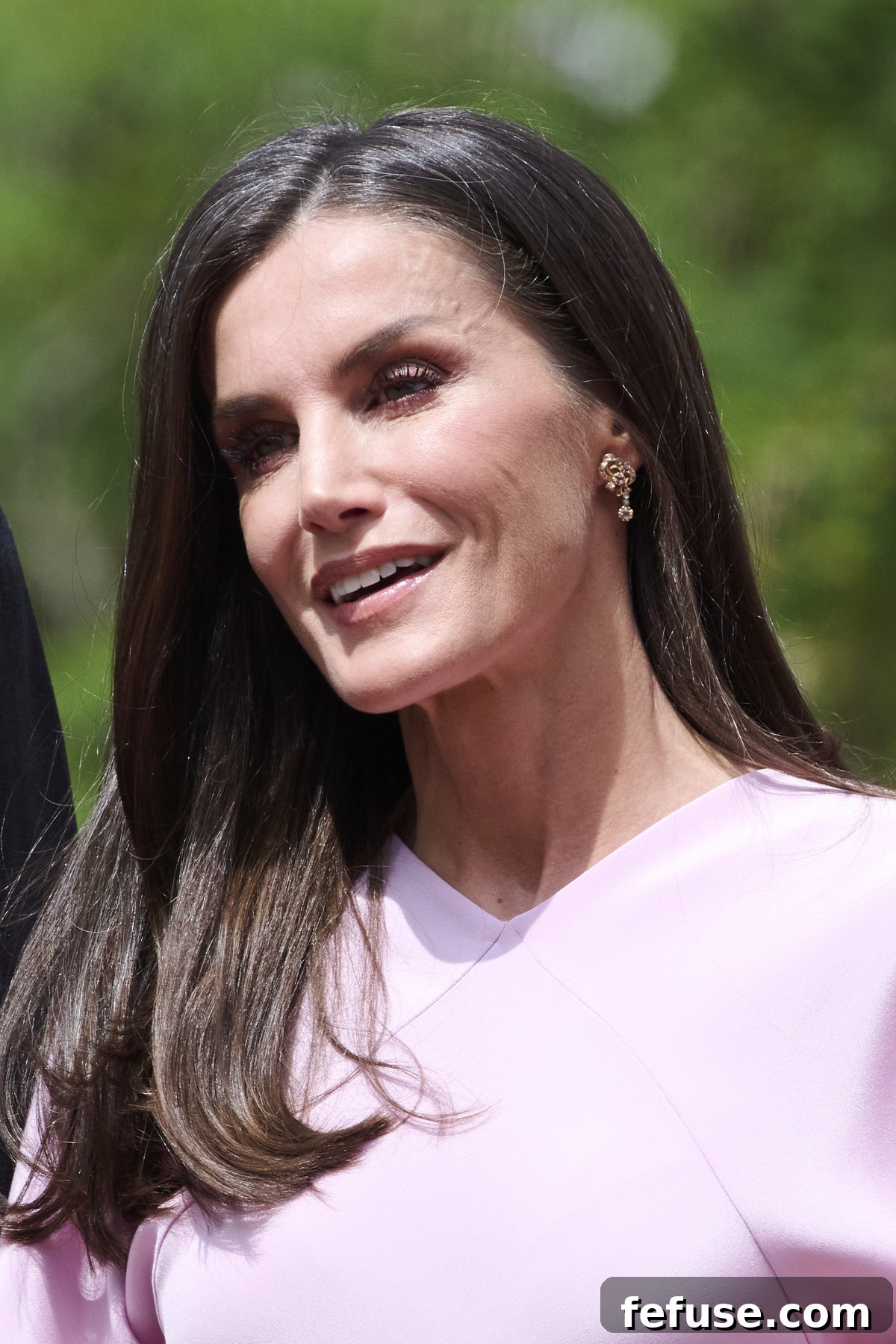 Queen Letizia of Spain wearing the same earrings at Infanta Sofia's confirmation, May 25, 2023