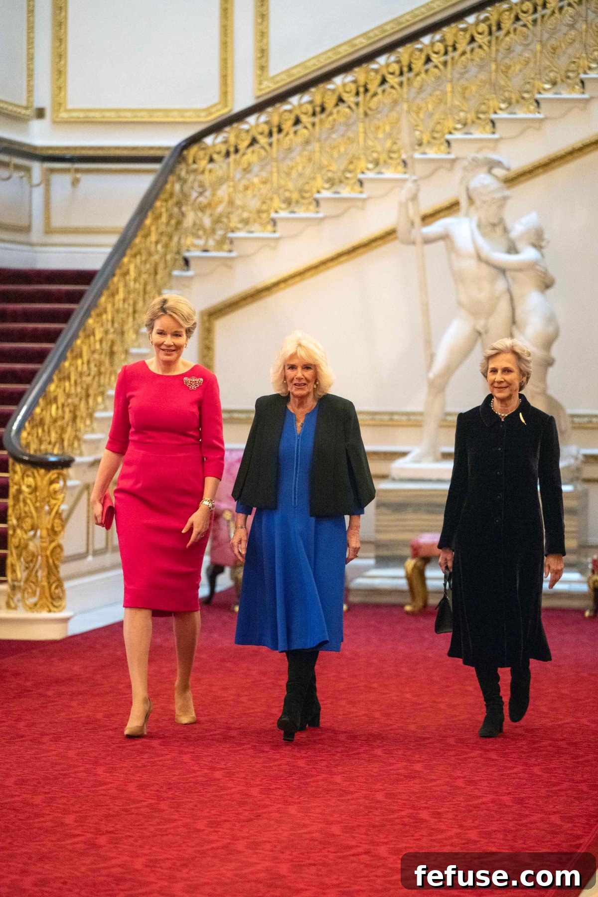 Queen Mathilde of the Belgians, the Duchess of Gloucester, and Queen Camilla posing elegantly at the WOW reception