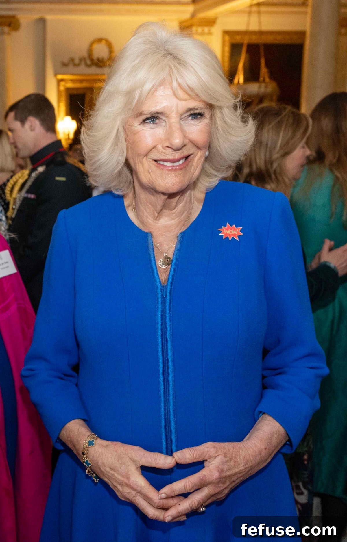 Close-up of Queen Camilla's jewelry, including her Van Cleef & Arpels bracelet and Queen Elizabeth II's earrings