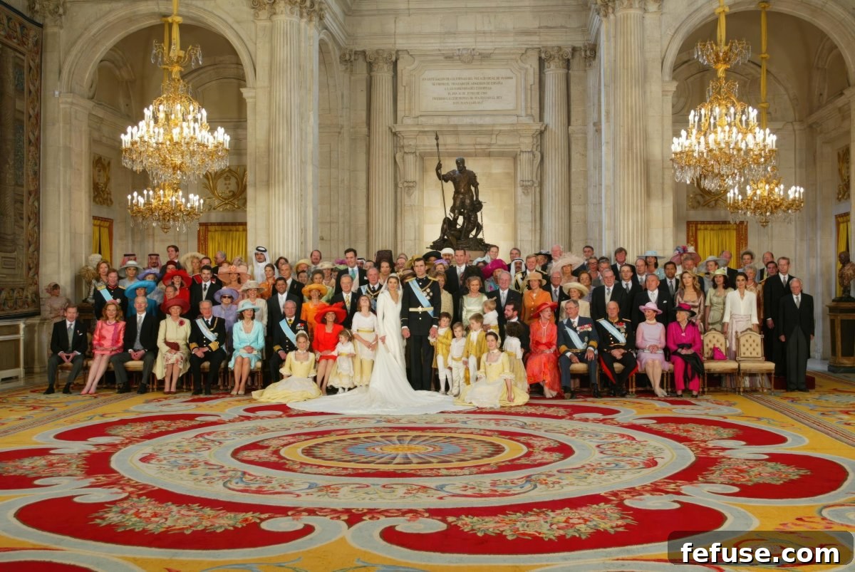 The Prince and Princess of Asturias pose for an official portrait with their guests at the Royal Palace in Madrid after their royal wedding ceremony on May 22, 2004 (Ernesto Agudo/Album/Alamy)