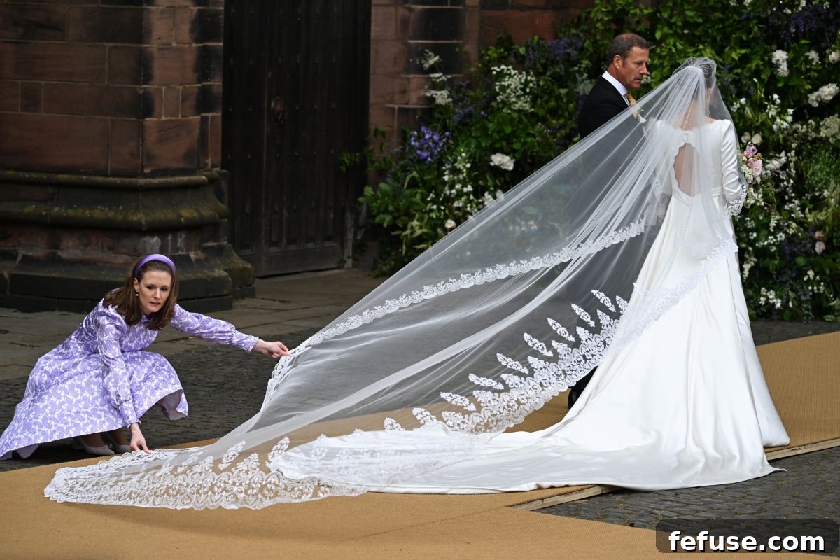 Olivia Henson arrives with her father, Rupert, for her wedding to the Duke of Westminster at Chester Cathedral on June 7, 2024 (Doug Peters/EMPICS/Alamy)