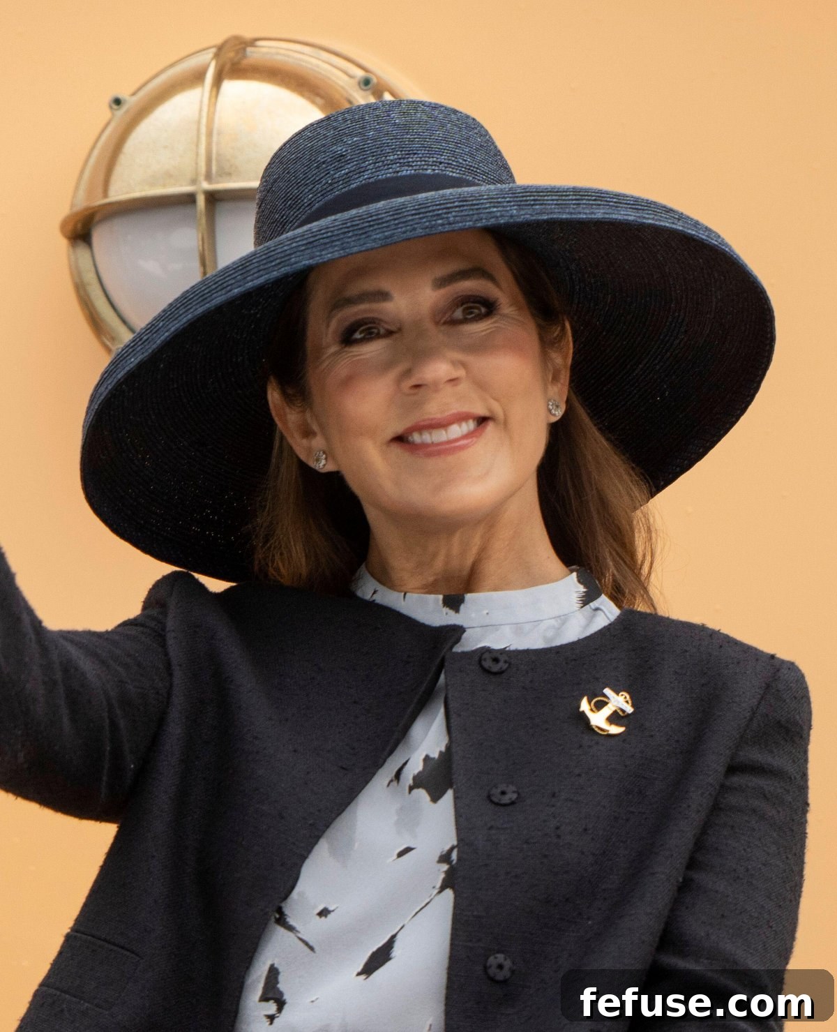 Queen Mary of Denmark in Velje, showcasing her ruby and diamond engagement ring and a diamond eternity band.