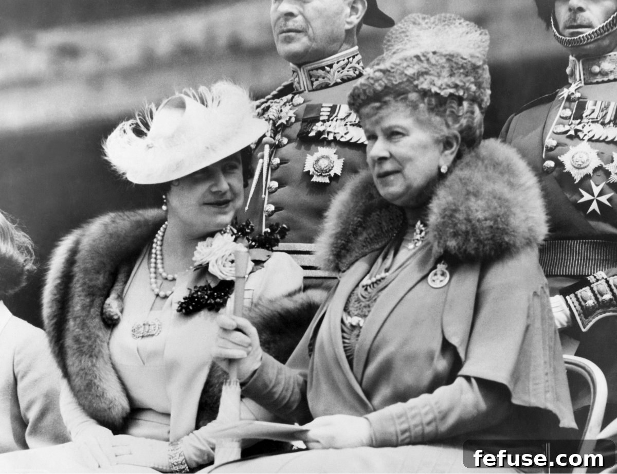 A Historic Sparkle: The Queen Mother's VE Day Cartier Brooch 6 Queen Elizabeth and Queen Mary watch as King George VI presents new colors to the 2nd Battalion Grenadier Guards at Buckingham Palace in London on May 25, 1938 (Underwood Archives/Alamy)