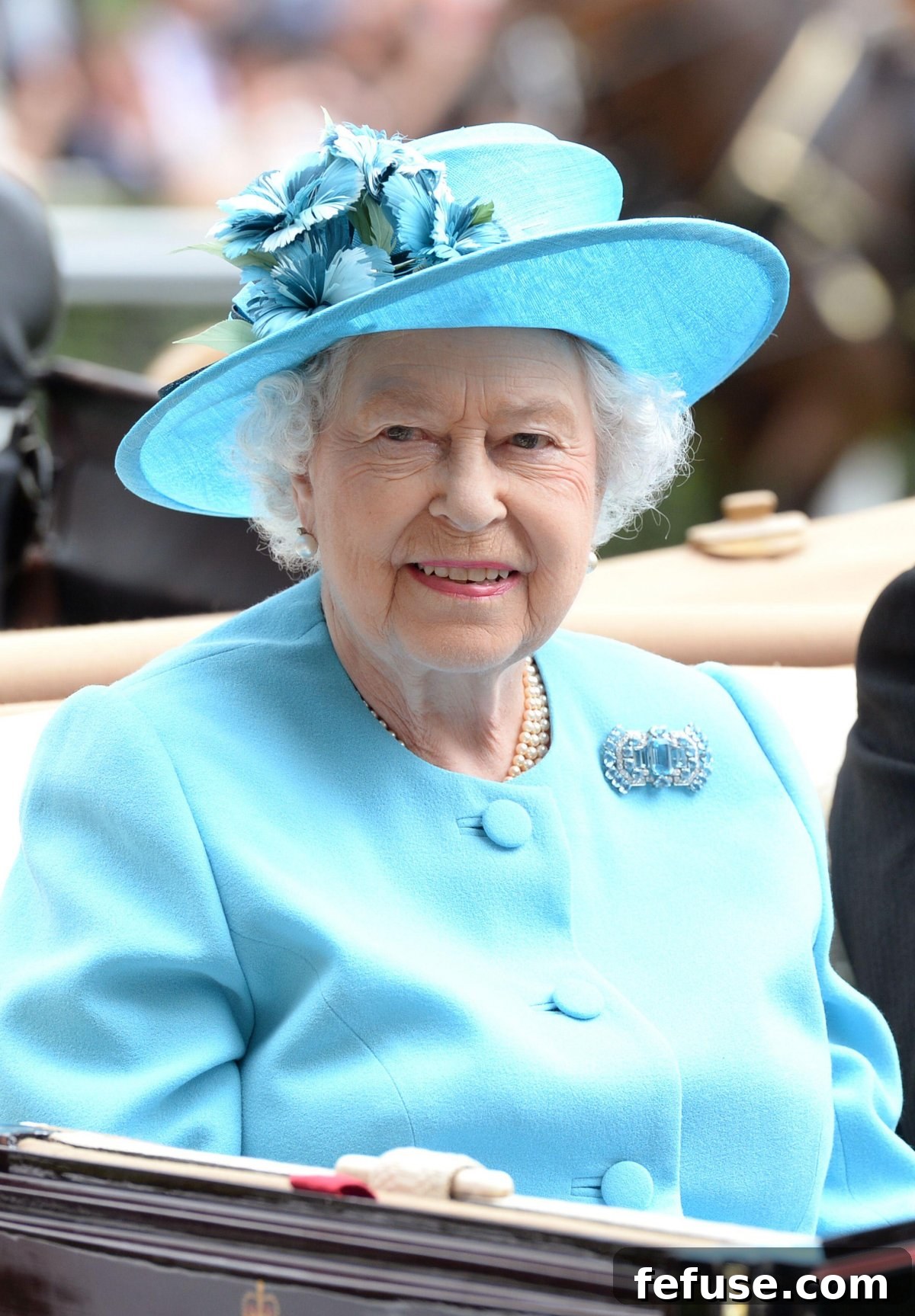 A Historic Sparkle: The Queen Mother's VE Day Cartier Brooch 9 Queen Elizabeth II attends Ladies' Day at Royal Ascot on June 19, 2014 (Doug Peters/Alamy)
