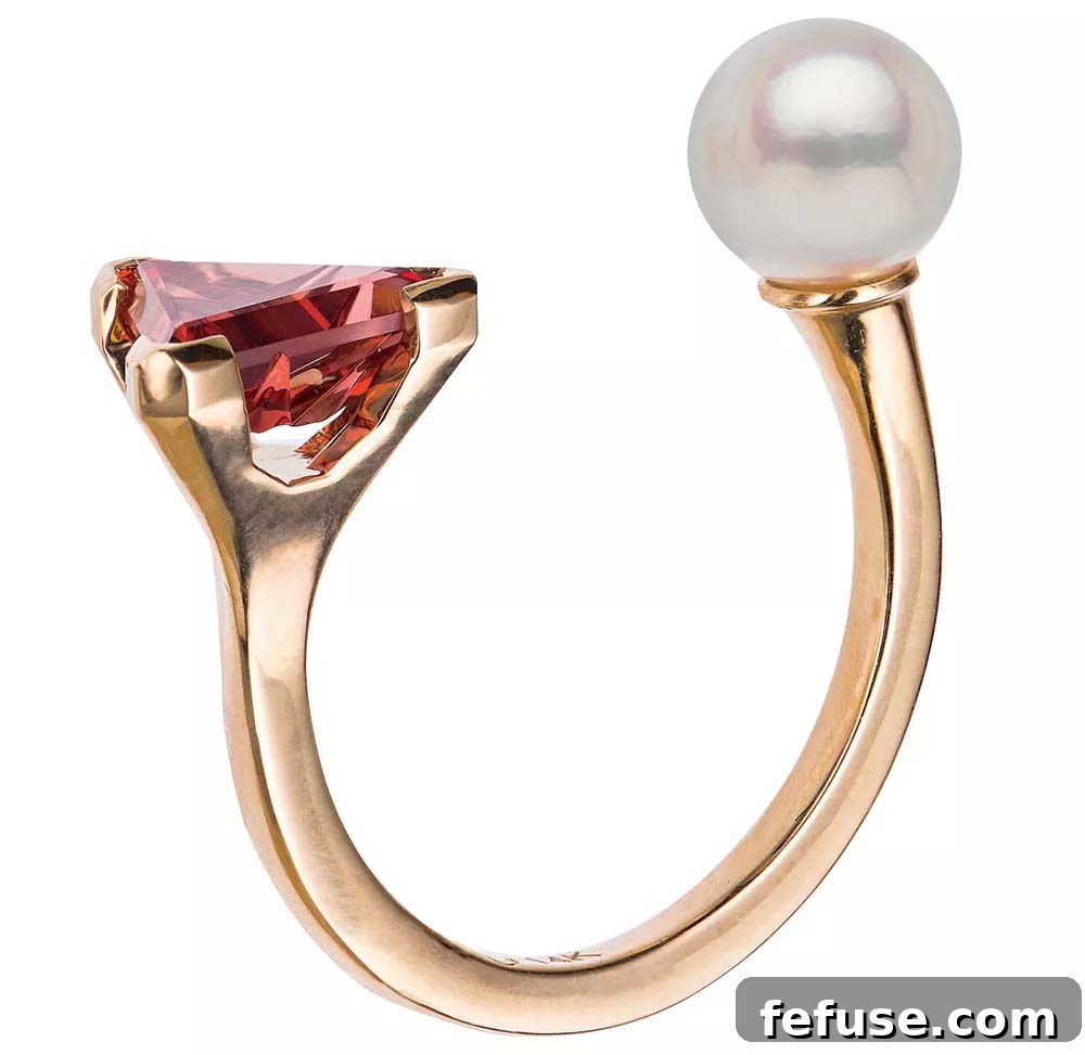 Zhulia Akoya Pearl Ring Ring with a Japanese Akoya pearl and garnet