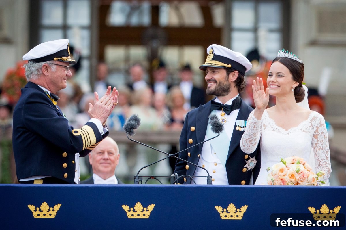 King Carl XVI Gustaf of Sweden is pictured with Prince Carl Philip and Princess Sofia after their wedding at the Royal Palace in Stockholm on June 13, 2015 (Patrick van Katwijk/DPA Picture Alliance/Alamy)