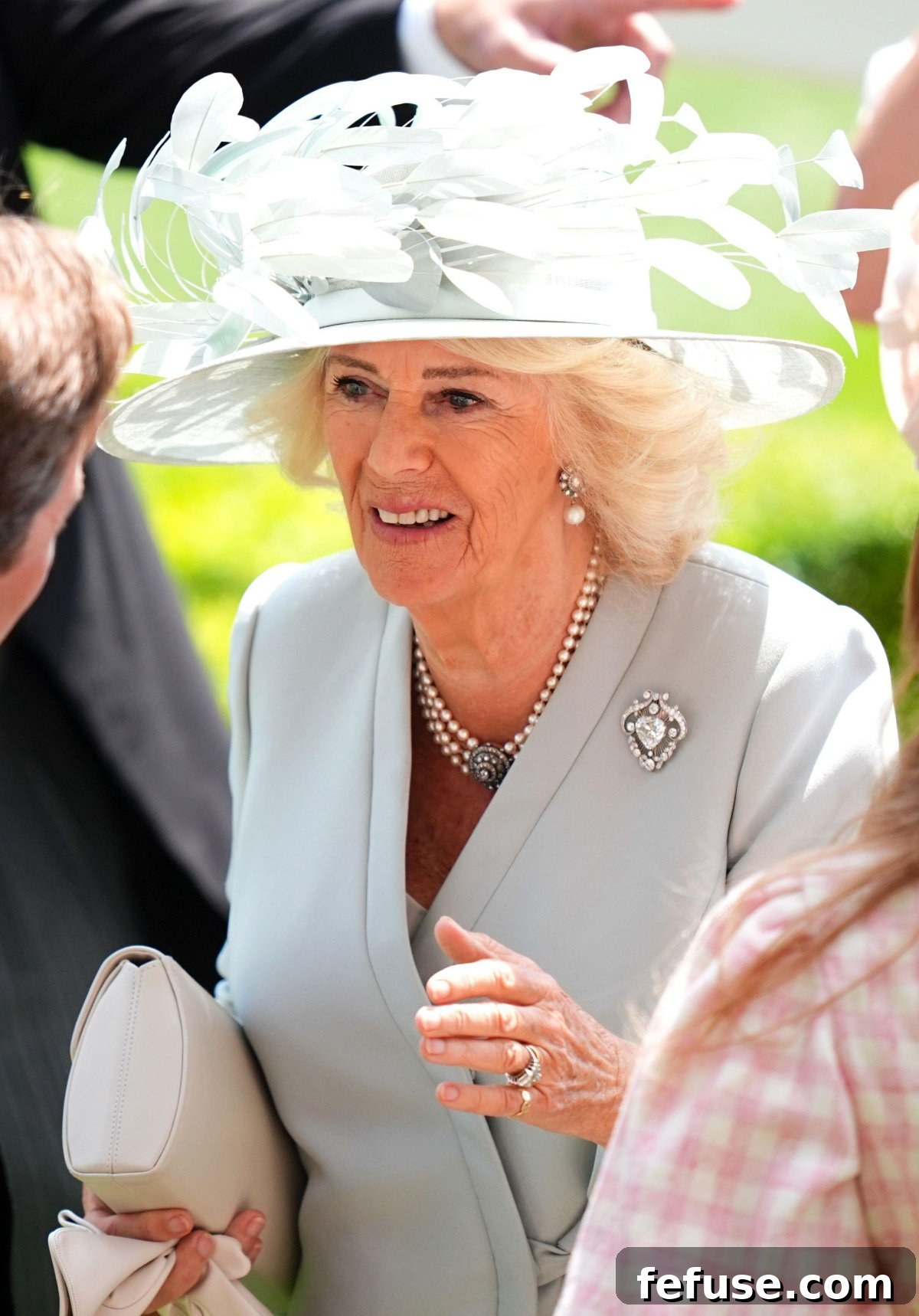 Queen Camilla adorned with the Cullinan V Brooch at Royal Ascot, showcasing her diamond and pearl earrings and choker