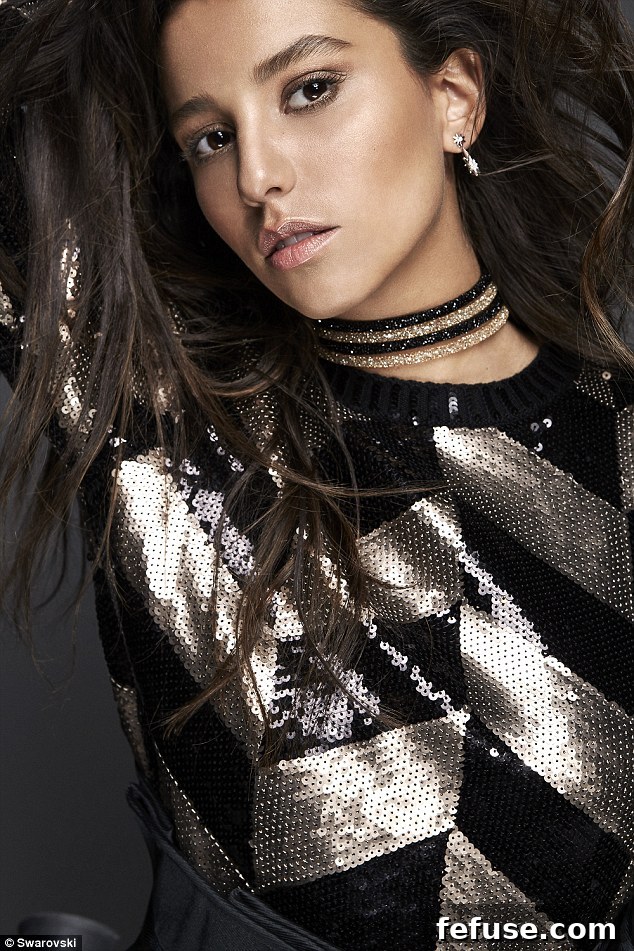 Vitoria Triboni highlights her striking facial features with choker-style necklaces for a bold fashion attraction