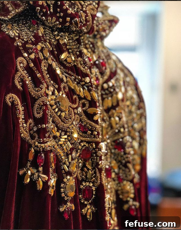 Close-up of Priyanka Chopra's intricate gold chainmail coif from the 2018 Met Gala, featuring shimmering Swarovski crystals and detailed gold beading.