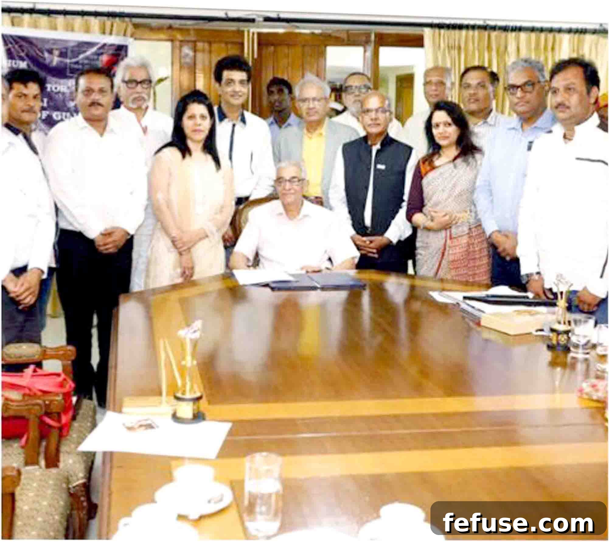 Dhiraj Kumar, Proprietor of D. J. Jewellers Ahmedabad, honored by Governor O.P. Kohli for outstanding contributions to the Gujarat gem and jewellery industry.
