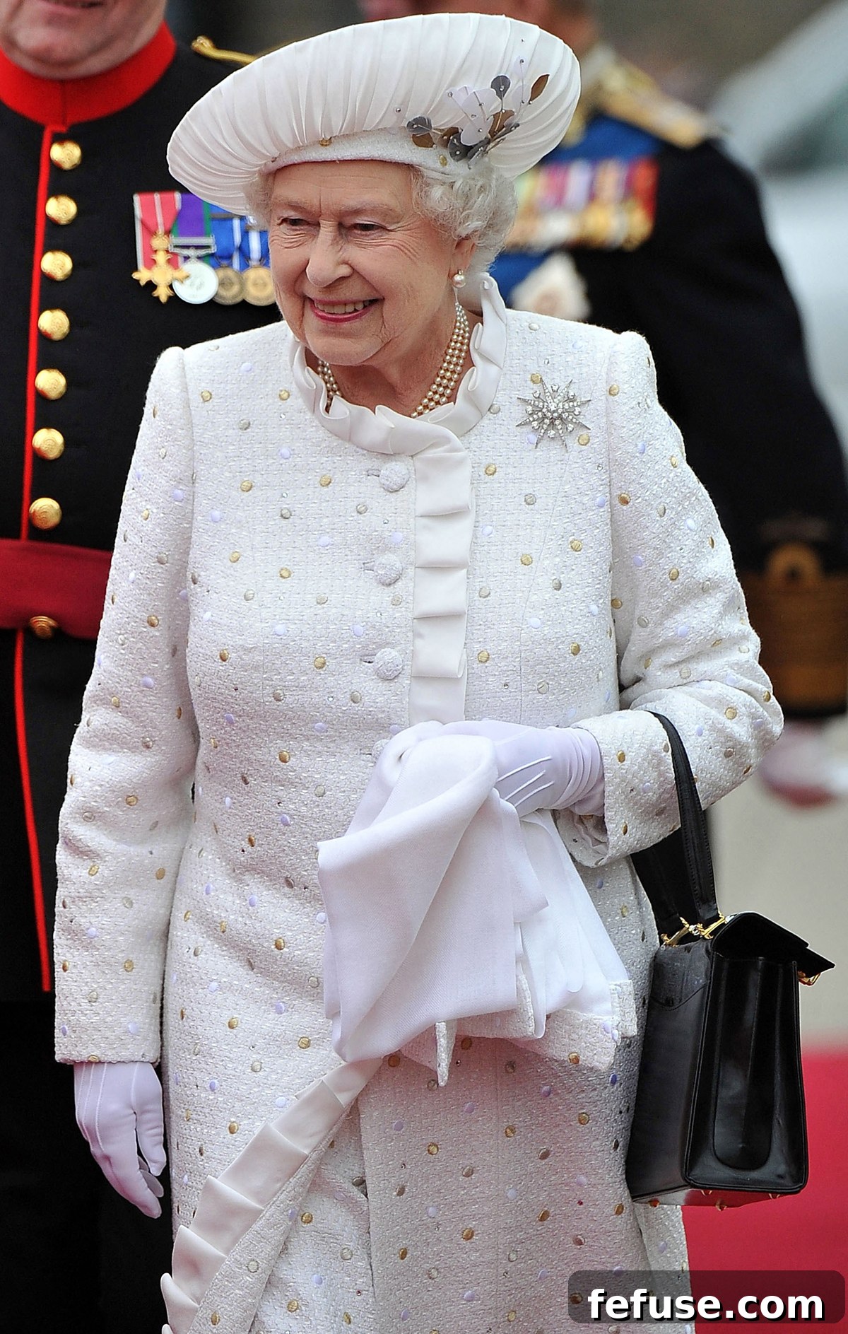 Queen Elizabeth II, adorned with the Jardine Star Brooch, attending the Thames Diamond Jubilee Water Pageant in London, June 3, 2012.